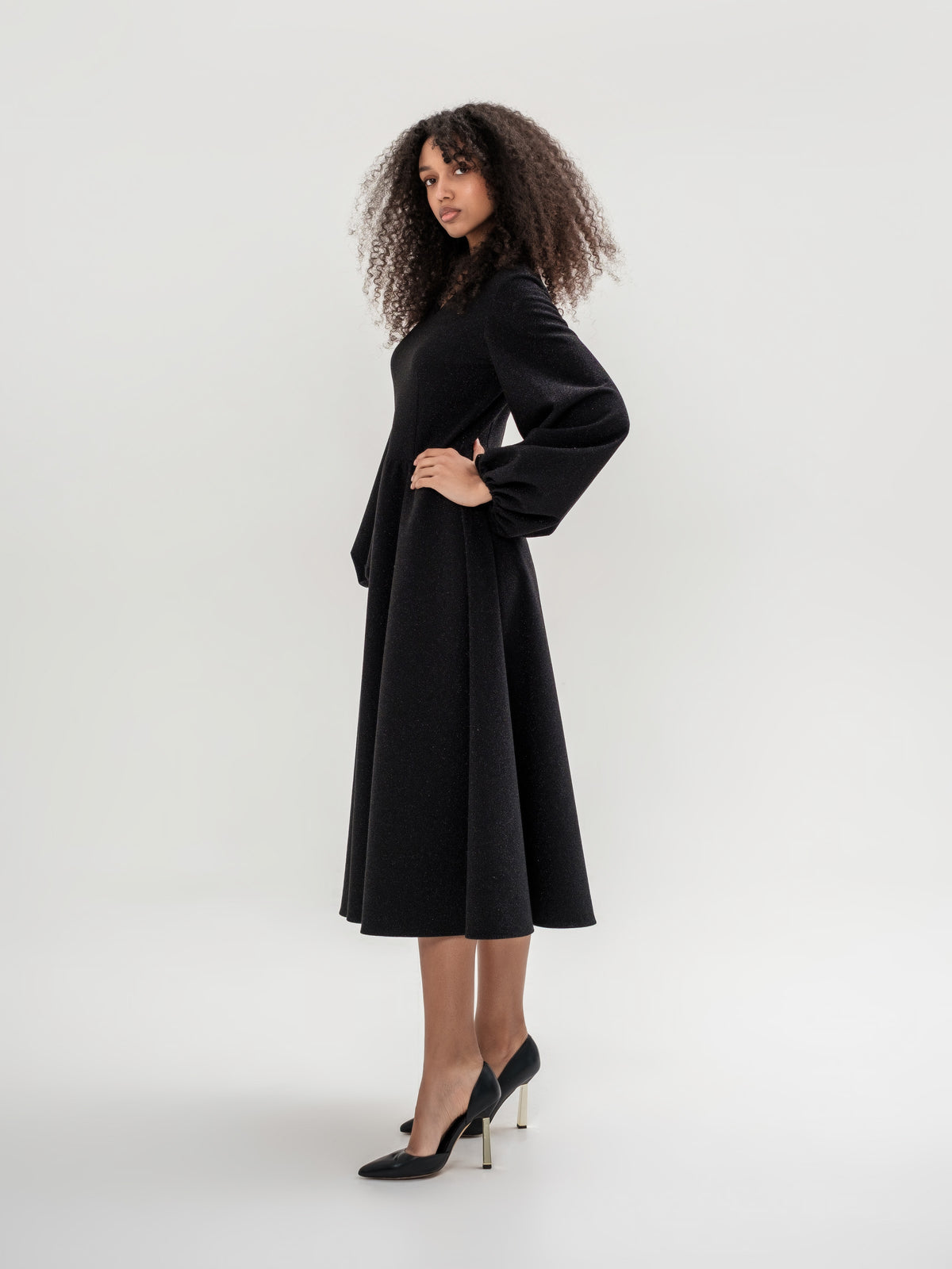 Black shiny thread midi dress with voluminous sleeves and a V-neck