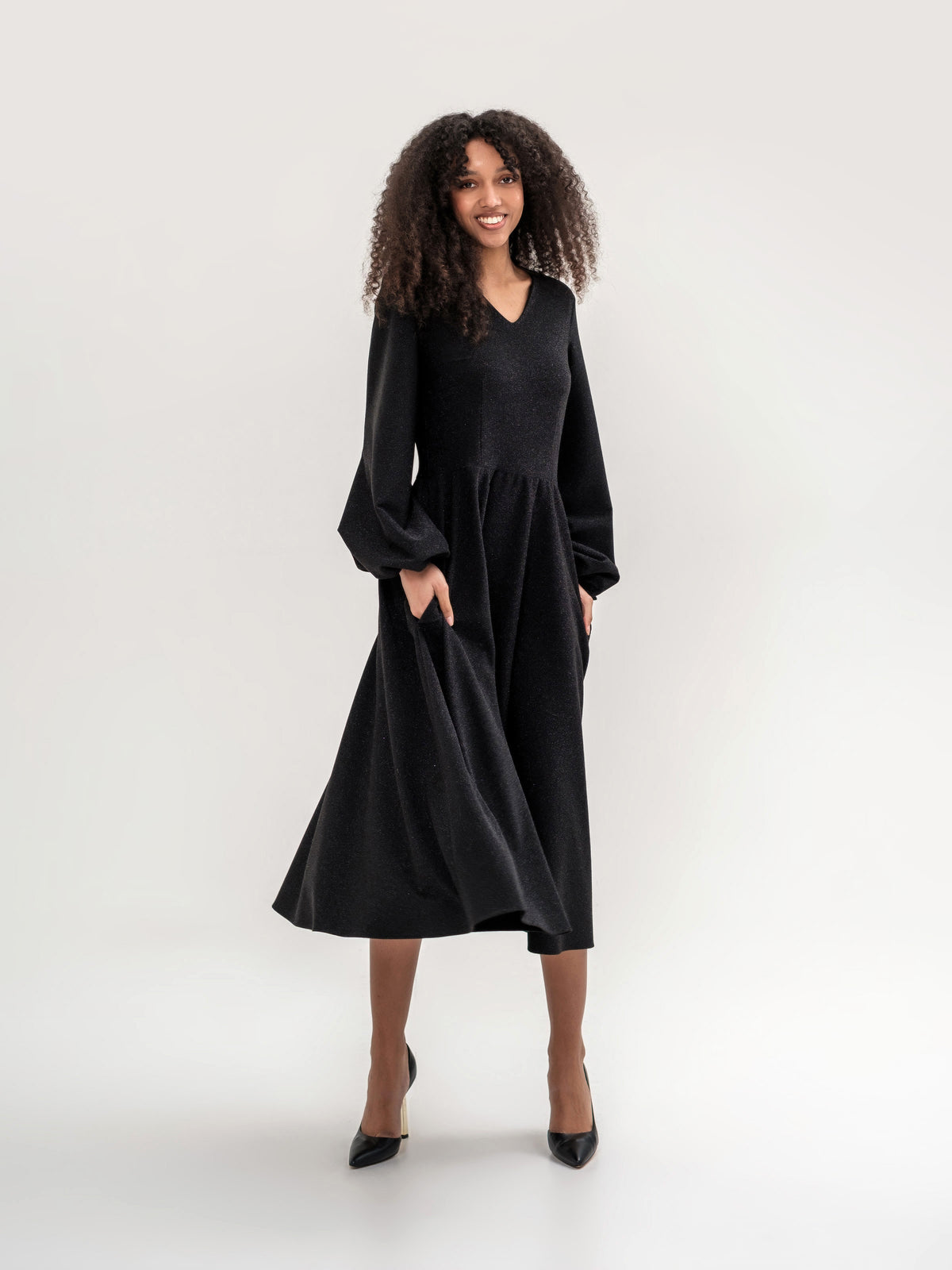 Black shiny thread midi dress with voluminous sleeves and a V-neck