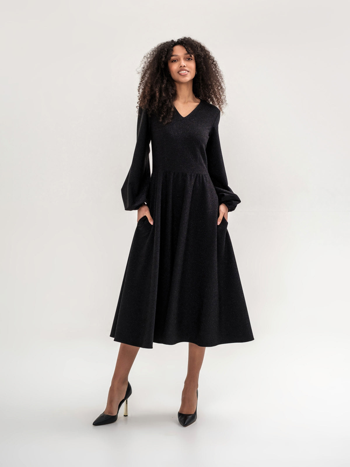 Black shiny thread midi dress with voluminous sleeves and a V-neck