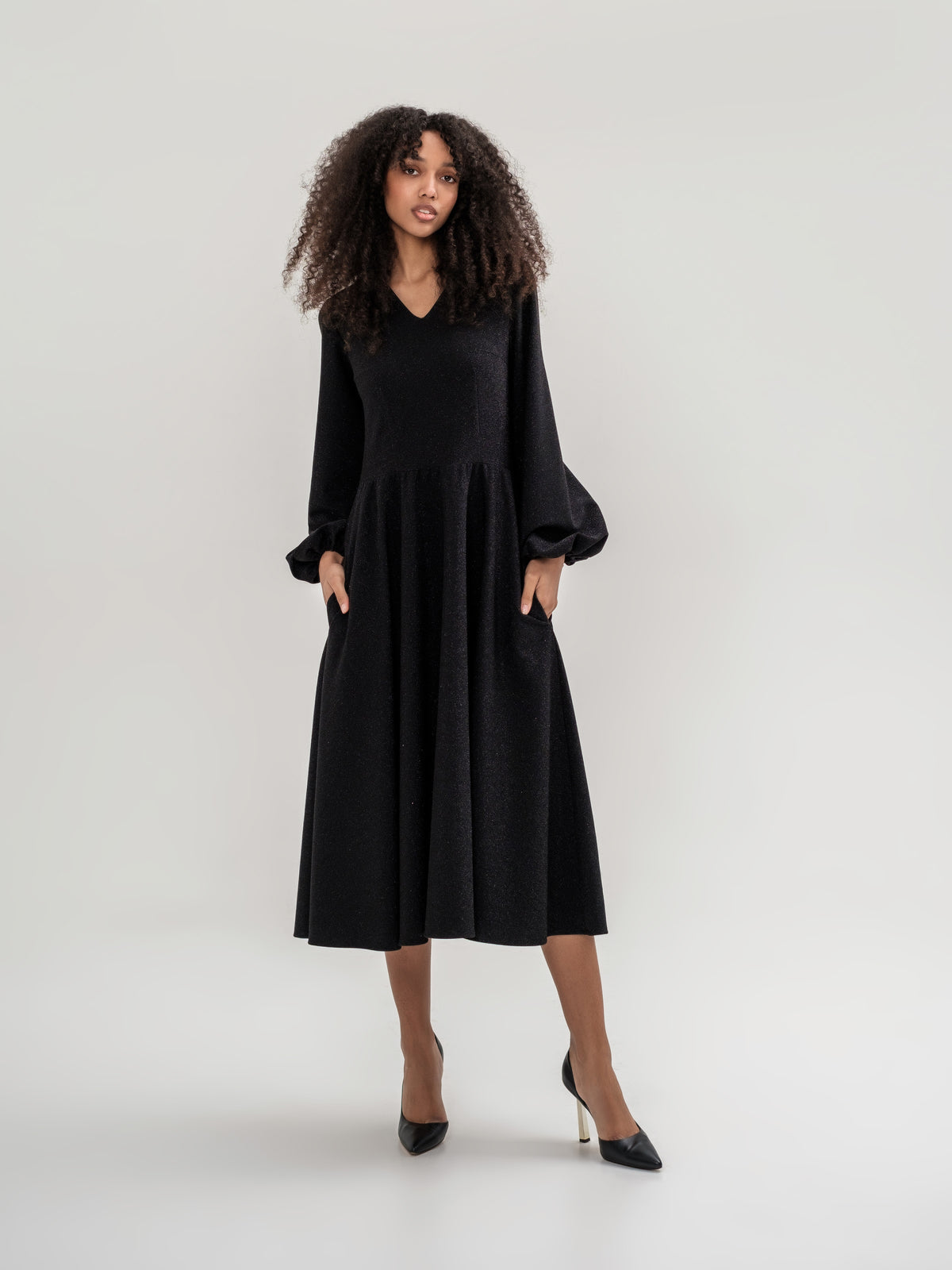 Black shiny thread midi dress with voluminous sleeves and a V-neck
