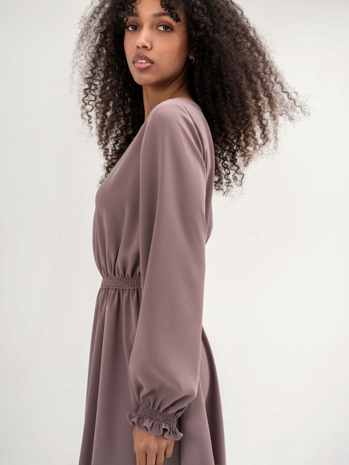 Classic midi cappuccino dress with long sleeves with elastic in the waistband and cuffs