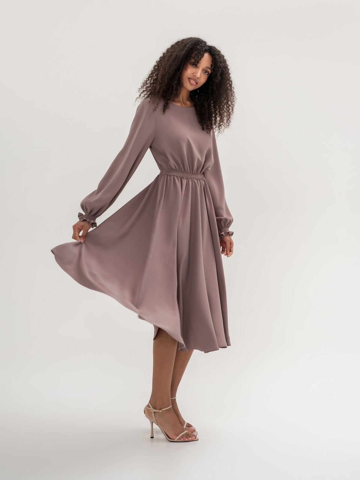 Classic midi cappuccino dress with long sleeves with elastic in the waistband and cuffs