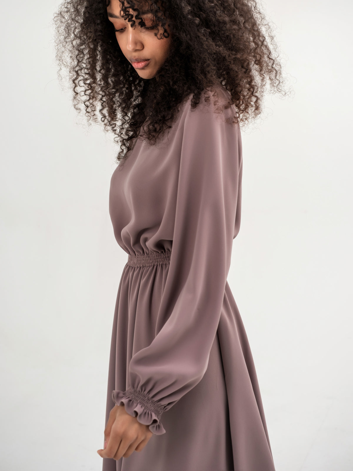 Classic midi cappuccino dress with long sleeves with elastic in the waistband and cuffs