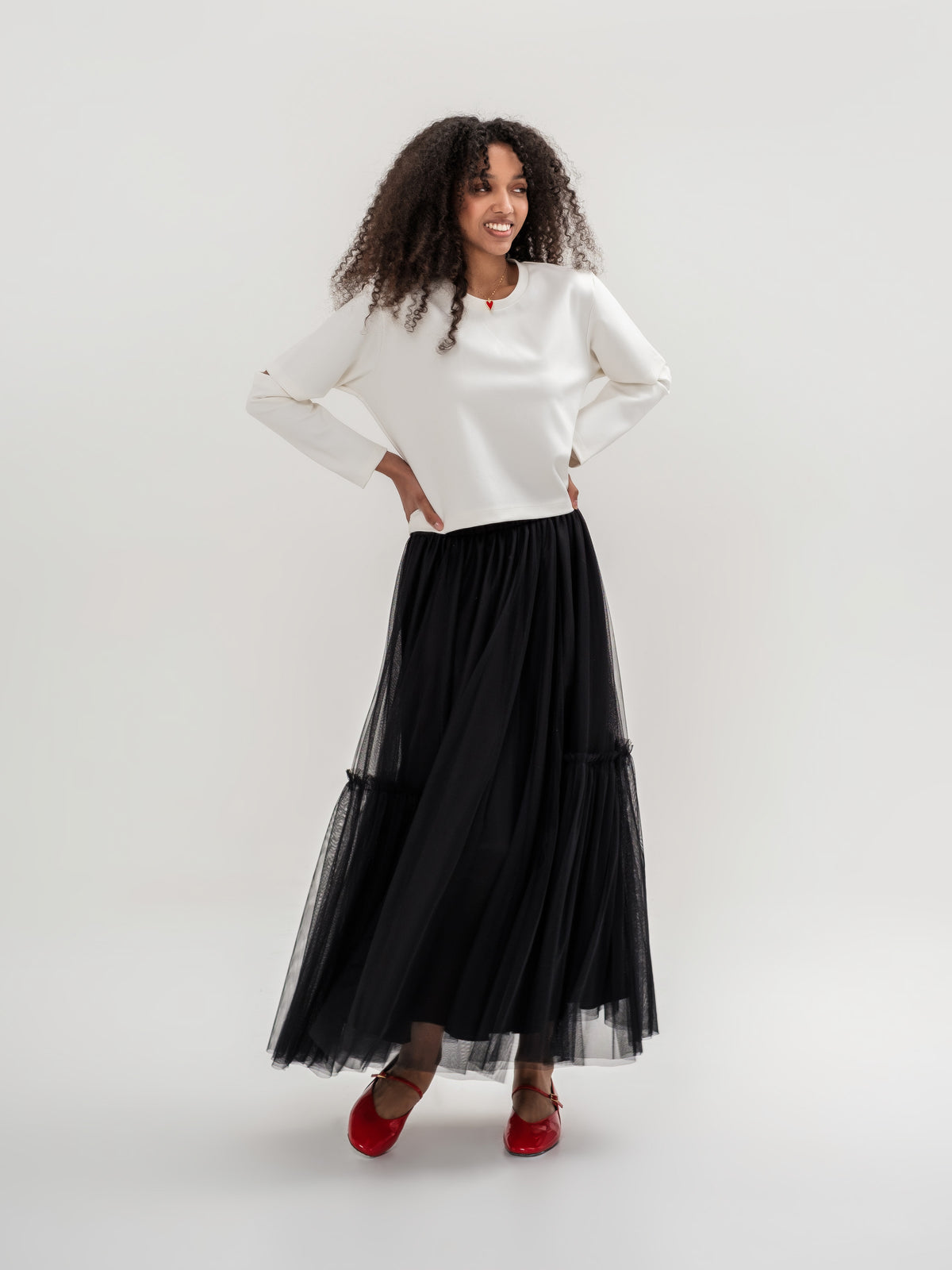 White top and black tulle lined skirt with elastic waist one size