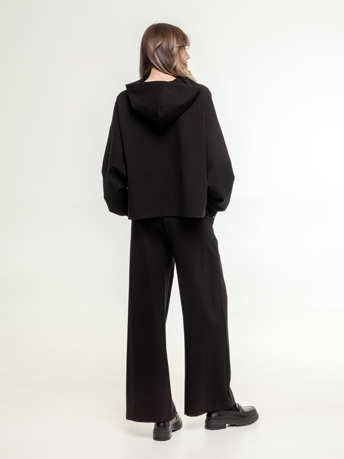 black wide short hoodie view from the back unisex